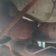 Right behind the muffler. Completely rusted through.